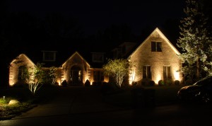 house in dark with up lights